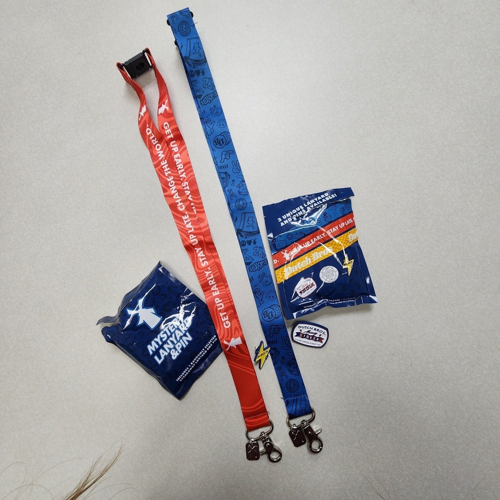 Set Of 2 Dutch Bros Pin and Lanyards 6/25/26 Red/Blue Lightning Bolt Always Stok